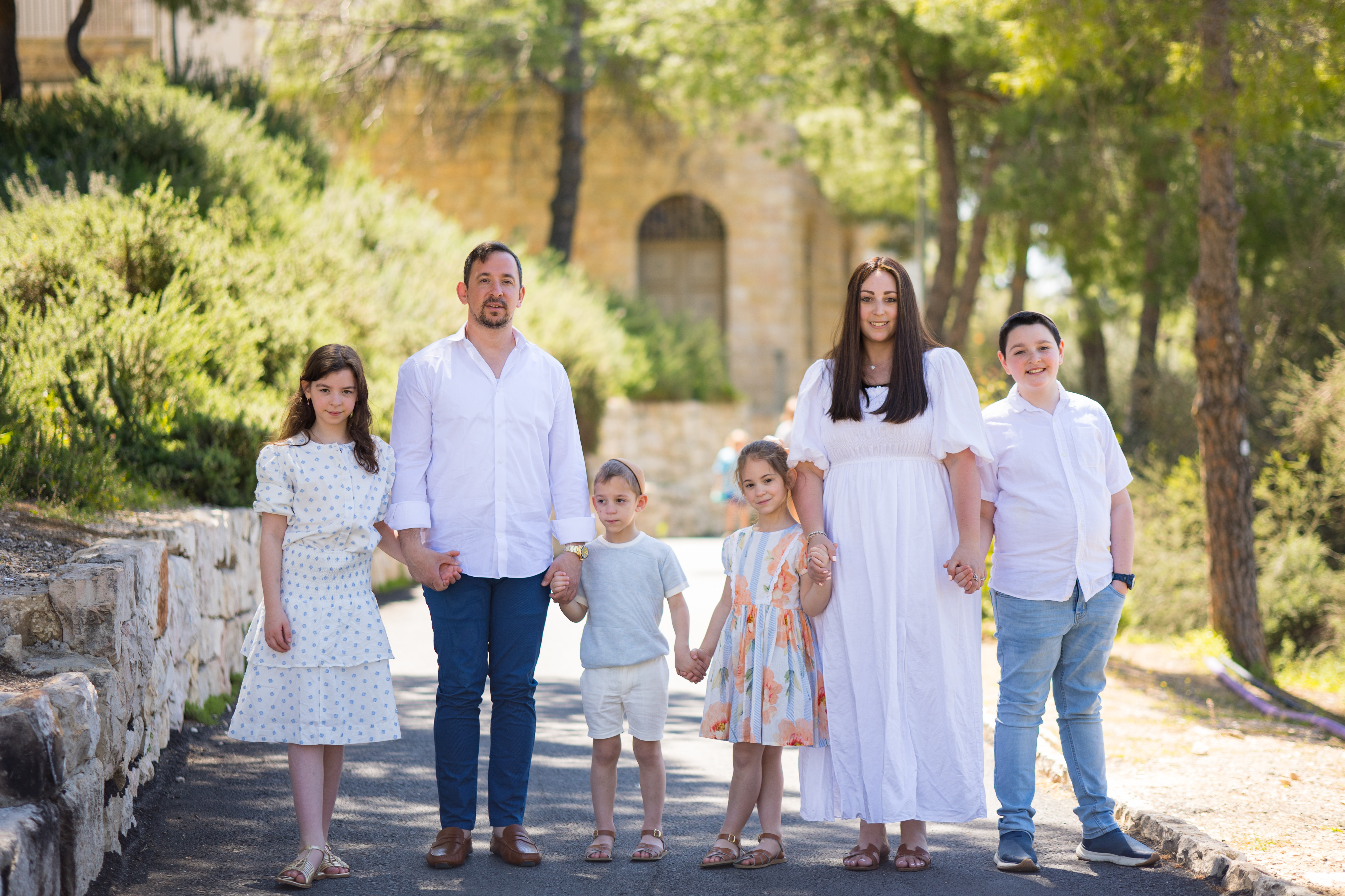 A family holding hands outdoors