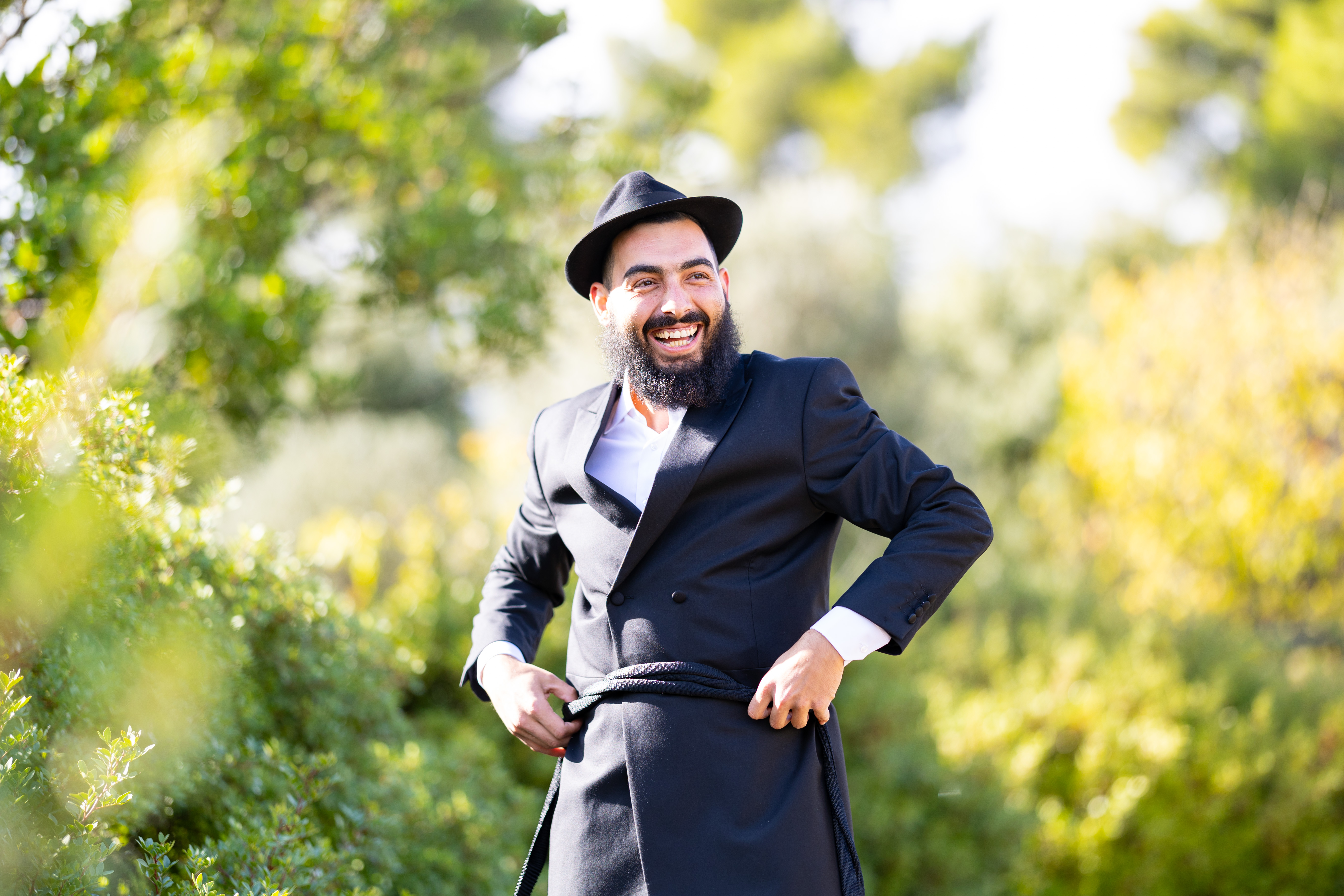 A smiling groom outdoors