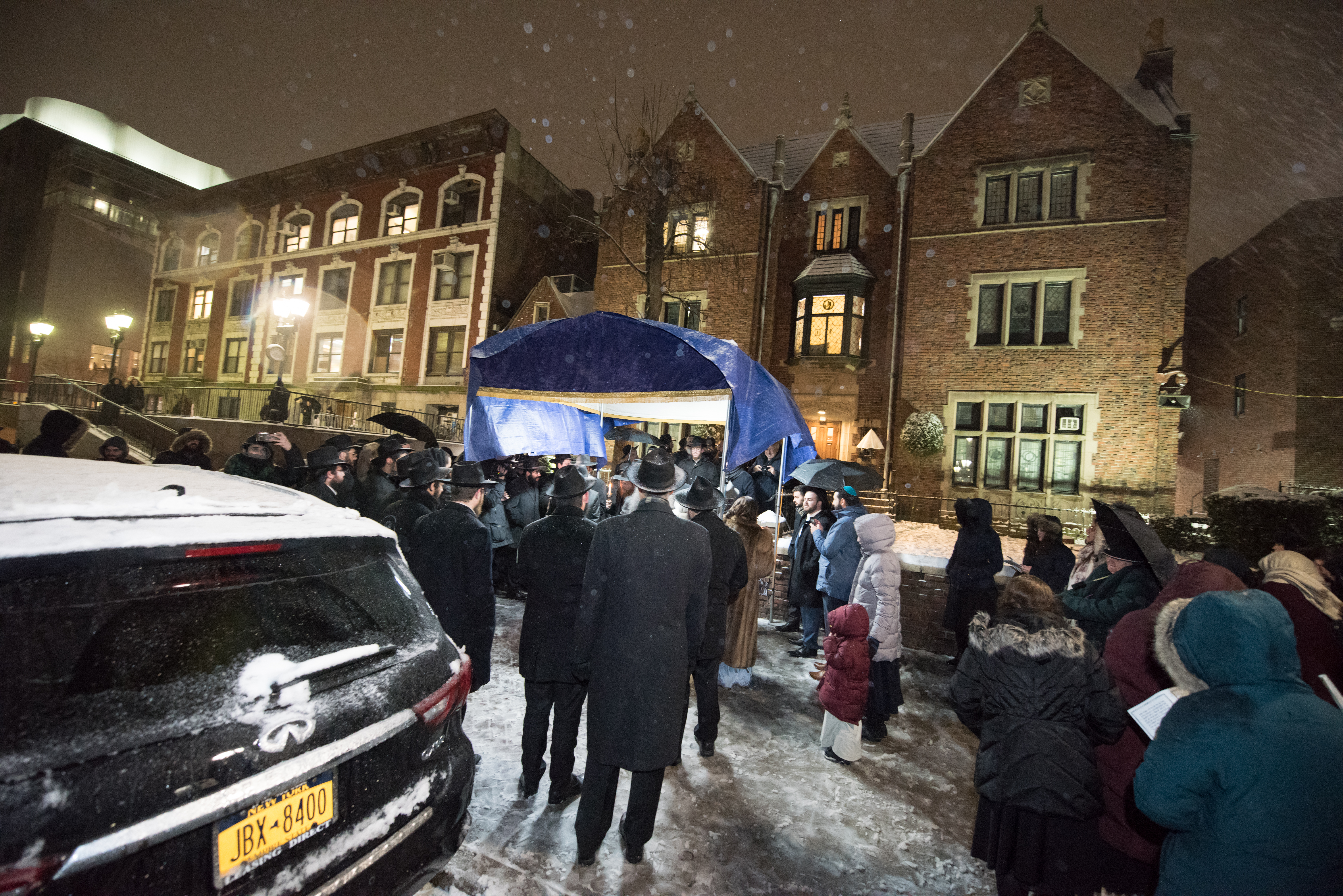 A wedding canopy on a snowy evening