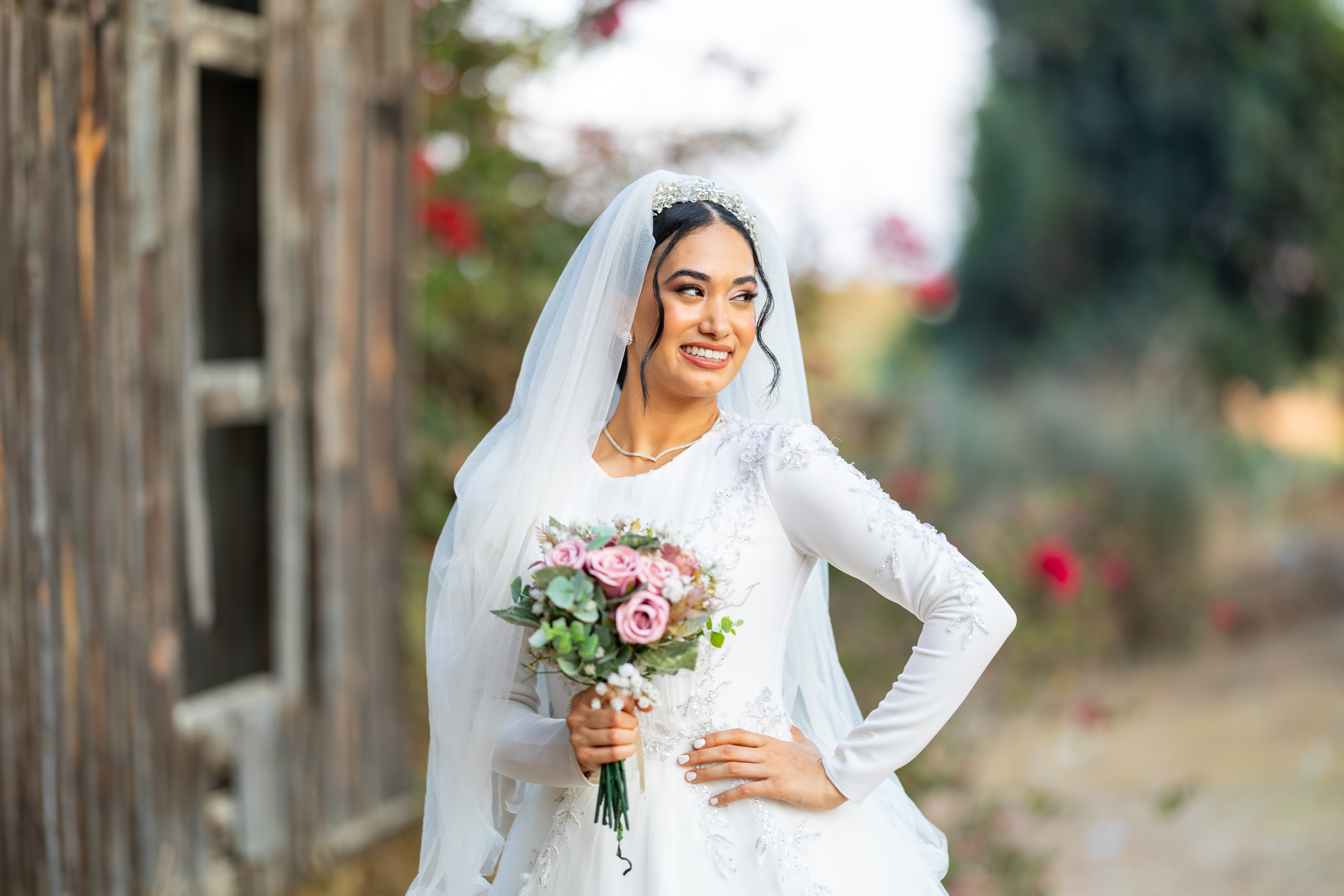 A smiling bride outdoors